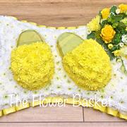Slippers on a pillow yellow