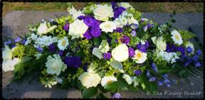 funeral flowers coffintop blue white roses